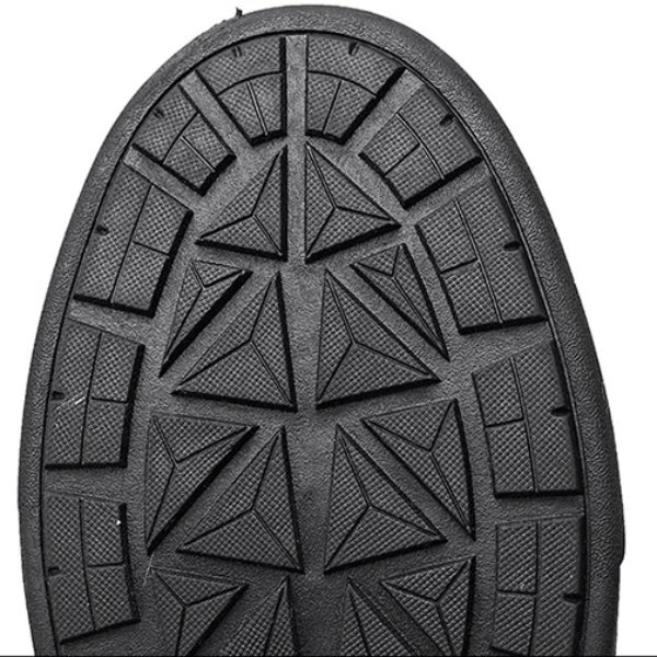 Close-up of black non-slip rubber outsole from women's waterproof hiking boot, showcasing detailed geometric tread pattern for grip.